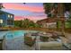 Serene backyard with a pool, spa, fire pit, and comfortable seating, perfect for entertaining at 764 Post Oak Dr, Mount Pleasant, SC 29464