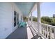 Relaxing balcony featuring blue ceiling, stylish railings and comfortable Adirondack chairs at 764 Post Oak Dr, Mount Pleasant, SC 29464