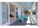 Inviting balcony with blue ceiling and Adirondack chairs offers tranquil relaxation at 764 Post Oak Dr, Mount Pleasant, SC 29464