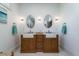 Bright bathroom features a stylish double sink vanity with marble countertop and oval mirrors at 764 Post Oak Dr, Mount Pleasant, SC 29464