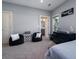 Bedroom with carpet floors and two beanbag chairs, offers easy access to the bathroom at 764 Post Oak Dr, Mount Pleasant, SC 29464