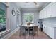 Bright dining area with built-in cabinets and a view of the outdoor deck at 764 Post Oak Dr, Mount Pleasant, SC 29464