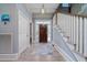 Inviting foyer features hardwood floors, a stylish rug, and a charming pendant light fixture at 764 Post Oak Dr, Mount Pleasant, SC 29464