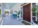 Inviting front porch with a cozy bench, planters, and a stylish entryway door at 764 Post Oak Dr, Mount Pleasant, SC 29464