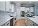 Modern kitchen with white countertops, stainless steel appliances, and ample cabinet space at 764 Post Oak Dr, Mount Pleasant, SC 29464