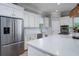 Bright kitchen with stainless steel appliances, white cabinetry, and a large island at 764 Post Oak Dr, Mount Pleasant, SC 29464