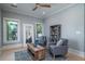 Inviting living room with comfortable seating, a rustic coffee table, and large windows offering scenic views at 764 Post Oak Dr, Mount Pleasant, SC 29464