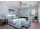 Cozy main bedroom with a ceiling fan, hardwood floors, and a calming color palette at 764 Post Oak Dr, Mount Pleasant, SC 29464