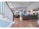 Spacious open floorplan with hardwood floors seamlessly connects the dining and kitchen areas at 764 Post Oak Dr, Mount Pleasant, SC 29464