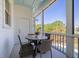 Charming screened-in porch with a round table and four chairs, perfect for outdoor dining and relaxation at 764 Post Oak Dr, Mount Pleasant, SC 29464