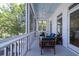Inviting screened-in porch featuring comfortable seating and serene views of the surrounding greenery at 764 Post Oak Dr, Mount Pleasant, SC 29464