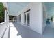 Beautiful long porch with white railings, offering a serene outdoor space for relaxation and enjoyment at 764 Post Oak Dr, Mount Pleasant, SC 29464
