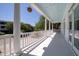 Expansive porch with white columns and railings, offering ample space for outdoor enjoyment and entertaining at 764 Post Oak Dr, Mount Pleasant, SC 29464