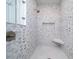 Stylish shower features mosaic tile surround, built-in bench, and niche shelving at 764 Post Oak Dr, Mount Pleasant, SC 29464
