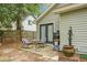Charming backyard patio area with seating, barbecue grill, and decorative water feature, perfect for outdoor entertaining at 7886 Racquet Rd, North Charleston, SC 29418