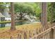 Scenic backyard with a tranquil pond, fountain, and lush greenery, perfect for outdoor enjoyment at 7886 Racquet Rd, North Charleston, SC 29418