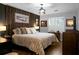 Cozy bedroom featuring unique wooden accent wall, calming artwork, and plush bedding for ultimate comfort at 7886 Racquet Rd, North Charleston, SC 29418