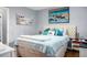 Bright bedroom with soft bedding, decorative pillows, and soothing wall art for a restful atmosphere at 7886 Racquet Rd, North Charleston, SC 29418