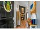 Inviting entryway featuring wood floors, a view of the fireplace, and coastal-themed décor at 7886 Racquet Rd, North Charleston, SC 29418