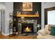 Elegant fireplace with stone surround, mantel and hearth, perfect for cozy evenings in the living room at 7886 Racquet Rd, North Charleston, SC 29418