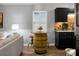 Efficient kitchen area with barrel-style table, modern appliances, and ample storage at 7886 Racquet Rd, North Charleston, SC 29418