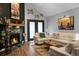 Cozy living room with a fireplace, comfortable seating, and stylish decor for relaxing or entertaining at 7886 Racquet Rd, North Charleston, SC 29418