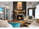 Comfortable living room featuring a fireplace, stylish furniture, and plenty of natural light at 7886 Racquet Rd, North Charleston, SC 29418