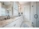 Modern bathroom with a double vanity, granite countertop, and a glass-enclosed shower at 7935 Flagship Ln, Johns Island, SC 29455