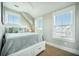 Charming bedroom with a queen-sized bed, hardwood floors, and lots of natural light at 7935 Flagship Ln, Johns Island, SC 29455