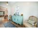 Entryway featuring shiplap walls, a turquoise sideboard, and a vintage rug with classic furniture at 7935 Flagship Ln, Johns Island, SC 29455