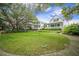 Beautiful homes surrounded by lush lawns and mature trees create a serene setting at 7935 Flagship Ln, Johns Island, SC 29455