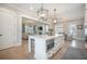 Open concept kitchen with a center island, stainless appliances, and view into the living room at 7935 Flagship Ln, Johns Island, SC 29455