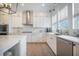 Bright kitchen features stainless steel appliances, white cabinets, and an island at 7935 Flagship Ln, Johns Island, SC 29455