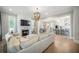 Open-concept living room flows into a spacious kitchen with a fireplace at 7935 Flagship Ln, Johns Island, SC 29455
