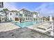 Resort-style pool featuring lounge chairs and a beautiful building backdrop at 7935 Flagship Ln, Johns Island, SC 29455