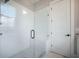 Modern tiled shower with glass door, rainfall shower head, and a built-in seat at 7935 Flagship Ln, Johns Island, SC 29455