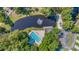 Aerial view of the community pool, pond with fountain, clubhouse, playground and tennis court at 7945 Parklane Ct # C, North Charleston, SC 29418