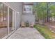 Private back patio with chairs, offering a relaxing outdoor living area with lush greenery at 7945 Parklane Ct # C, North Charleston, SC 29418