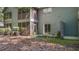 Townhome with an outdoor space, including a screened-in porch, and views of mature trees at 7945 Parklane Ct # C, North Charleston, SC 29418