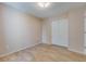 Neutral bedroom showcasing wood-look floors, fresh paint, and a closet for tidy storage at 7945 Parklane Ct # C, North Charleston, SC 29418