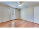 Bedroom with hardwood floors, a ceiling fan, a window, and a closet door at 7945 Parklane Ct # C, North Charleston, SC 29418