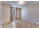 Cozy bedroom features modern floors, a window, neutral walls, and ample natural light at 7945 Parklane Ct # C, North Charleston, SC 29418