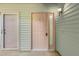 Exterior view of two unit entrances, each with unique doors and exterior lighting at 7945 Parklane Ct # C, North Charleston, SC 29418