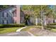 Inviting multi-level condo with manicured landscaping and classic shuttered windows at 7945 Parklane Ct # C, North Charleston, SC 29418