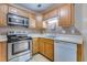 Kitchen features stainless steel appliances and light wood cabinets, offering a functional layout at 7945 Parklane Ct # C, North Charleston, SC 29418