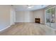 Spacious living room features modern flooring, a fireplace, and a sliding glass door at 7945 Parklane Ct # C, North Charleston, SC 29418