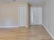 Bright living room featuring wood-look flooring, neutral paint, and updated doors at 7945 Parklane Ct # C, North Charleston, SC 29418