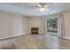 Bright living room with wood floors, fireplace, and sliding glass doors at 7945 Parklane Ct # C, North Charleston, SC 29418