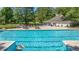 Sparkling community pool with lounge chairs, picnic tables, and a nearby clubhouse at 7945 Parklane Ct # C, North Charleston, SC 29418