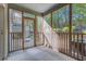 Inviting screened porch provides a relaxing outdoor space surrounded by nature at 7945 Parklane Ct # C, North Charleston, SC 29418